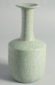 A CHINESE CRACKLE GLAZED CELADON BOTTLE VASE, 23.5cm high.