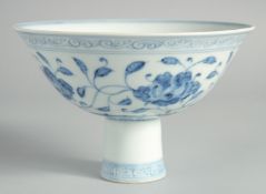 A CHINESE BLUE AND WHITE PORCELAIN STEM CUP, decorated with flowers and vine, with six-character
