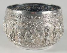A VERY FINE AND LARGE 19TH CENTURY BURMESE SILVER BOWL, relief-decorated with figures and animals,
