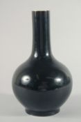 A CHINESE FAMILLE NOIR PORCELAIN BOTTLE VASE, the base with six-character mark, 28.5cm high.