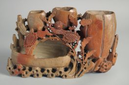 A CHINESE SOAPSTONE CARVING, (af), 24cm wide.