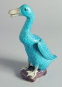A CHINESE BLUE GLAZE POTTERY FIGURE OF A DUCK, impressed mark to base, 19cm high.