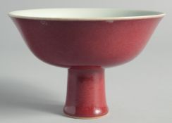 A CHINESE RED GLAZE PEDESTAL BOWL, with six-character mark to inner foot rim, bowl 15cm diameter.