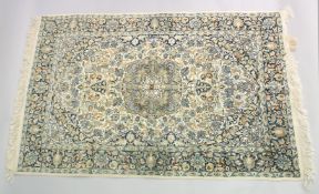 A LARGE PERSIAN NAIN RUG, with floral motif decoration, 190cm x 125cm.