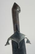 AN EARLY PERSIAN SWORD WITH WATERED STEEL BLADE AND RHINO HORN HANDLE, with leather covered