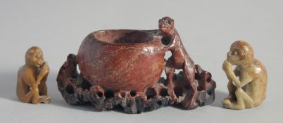 THREE CHINESE SOAPSTONE CARVINGS OF MONKEYS.