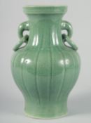 A LARGE CHINESE CELADON CRACKLE GLAZE VASE, with ribbed body and moulded drop ring handles, 30.5cm