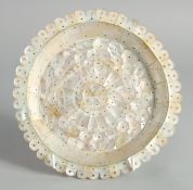 AN INDIAN GOA MOTHER OF PEARL DISH, 19cm diameter.