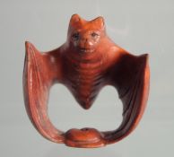 A JAPANESE BOXWOOD NETSUKE OF A BAT.
