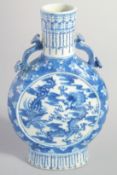 A CHINESE BLUE AND WHITE PORCELAIN MOONFLASK, with moulded handles and painted with dragon and