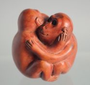 A JAPANESE BOXWOOD NETSUKE OF MONKEYS.