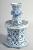 A LARGE CHINESE MING STYLE BLUE AND WHITE PORCELAIN CANDLE STAND, decorated with panels of flora,