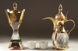 A ROYAL SAUDI GIFT BOX, comprising a glass ewer, two porcelain cups and a glass container.