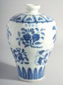 A CHINESE MING STYLE BLUE AND WHITE MEIPING VASE, decorated with various blossoming fruit, 29cm
