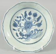 A CHINESE BLUE AND WHITE PORCELAIN PETAL FORM BOWL, the interior with central floral spray, exterior