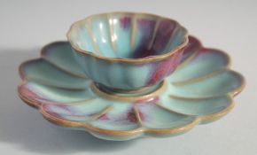 A CHINESE JUN WARE PETAL FORM CUP AND STAND, cup diameter 7.5cm, stand 14.5cm diameter.