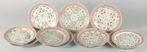 A COLLECTION OF ELEVEN CHINESE FAMILLE VERTE PORCELAIN PLATES, each painted with a central roundel