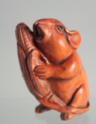 A JAPANESE BOXWOOD NETSUKE OF A RAT.