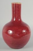A CHINESE COPPER RED GLAZE VASE, 32cm high.