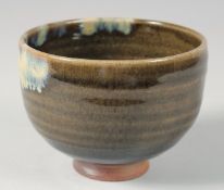 A CONTEMPORARY JAPANESE GLAZED POTTERY BOWL, signed, in original wooden box, bowl 12cm diameter.