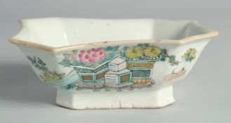 A CHINESE FAMILLE ROSE PORCELAIN OCTAGONAL BOWL, painted with flower pots and inscription.
