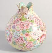 A CHINESE FAMILLE ROSE PORCELAIN POMEGRANATE SHAPE VASE, painted all over with multiple flower heads