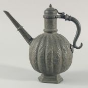 AN 18TH CENTURY MUGHAL INDIAN TINNED COPPER EWER, the ribbed body with embossed foliate