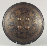 A VERY FINE 19TH CENTURY NORTH INDIAN GOLD OVERLAID CHISELLED STEEL SHIELD, possibly Sikh, decorated