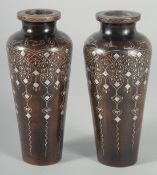 A FINE PAIR OF OTTOMAN TURKISH SILVER INLAID WOODEN VASES, signed, 16.5cm high.