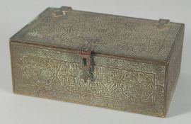 A 19TH CENTURY SYRIAN DAMASCUS ENGRAVED BRASS QURAN BOX, with panels of calligraphy, 14cm x 9cm.