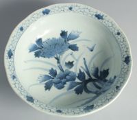 A LARGE CHINESE BLUE AND WHITE PORCELAIN BOWL, painted with flora, 31.5cm diameter.
