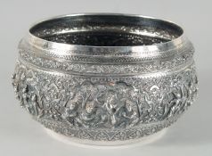 A FINE 19TH CENTURY BURMESE SILVER BOWL, relief-decorated with scenes of multiple figures,