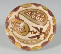 A SMALL ABBASID GLAZED POTTERY BOWL, the interior painted with foliate motif, 11cm diameter.