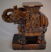 Large brown ceramic elephant stand. Ht 58cm