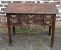 Heavily carved oak lowboy with brass handles L91cm D50cm Ht 71cm