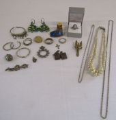 Collection of costume jewellery to include a silver badge and Wedgwood ring