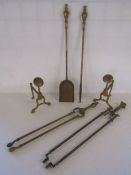 Pair of brass fire dogs and some fire irons