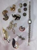 A collection of costume jewellery to include a silver cocktail watch by Woodford