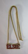9ct Gold 'ELSIE' pendant and yellow metal chain total weight 3.6g