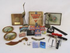 Collection of items to include playing cards, corkscrews, brass herons, Pathescope film,