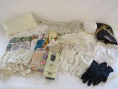 Collection of linen to include a Hindu deity design, net, doilies, ladies gloves, handkerchiefs etc