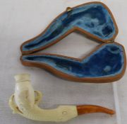 Meerschaum pipe, the bowl inset within carved dragon claws, amber mouth piece and original fitted