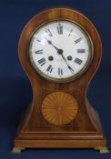 Edwardian French inlaid mahogany balloon striking mantel clock on brass feet, the backplate