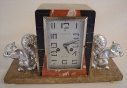 Art Deco marble striking clock flanked by two squirrels Ht 23 L 38cm