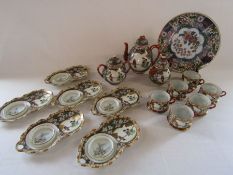 Japanese egg shell tea set (one tea cup has a chip) and a Japanese plate with floral design