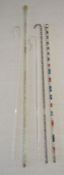 5 glass canes - clear glass spirally moulded containing coloured beads, 2 x shepherd's crooks