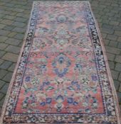 Washed red ground Persian runner 290cm by 113cm
