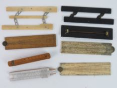 A quantity of vintage boxwood and ivory rulers, squares and cantilever rules.