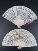 A late 19th / early 20th century 'Empire Made' cellulose pierced and decorated fan,