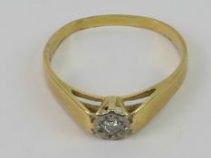 A vintage 18ct gold diamond solitaire ring, round cut in illusion setting,